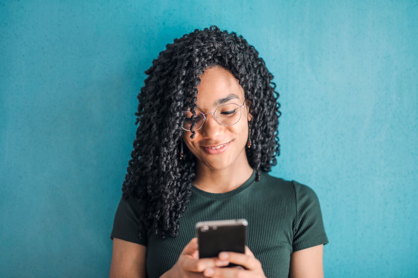 Smiling woman checking her phone