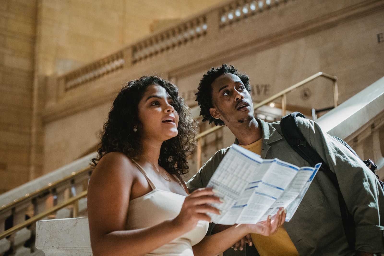 Couple planning a trip with a map