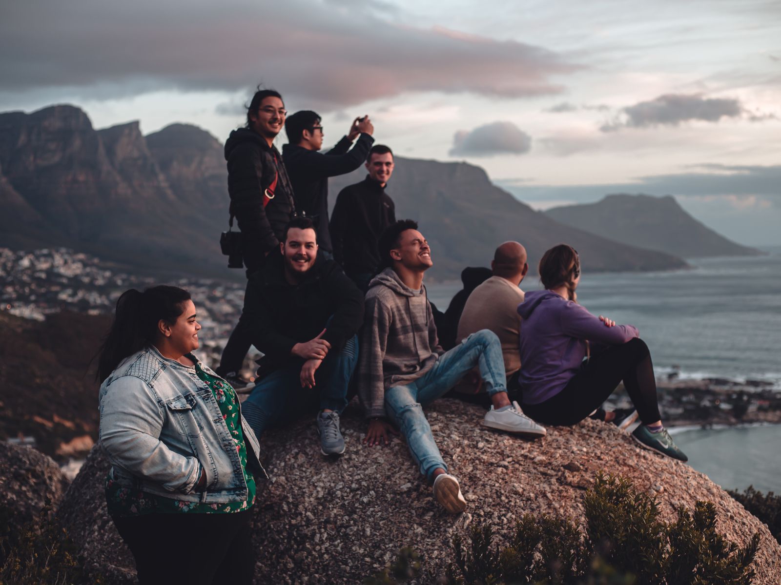 Friends enjoying a mountain view on an outdoor trip